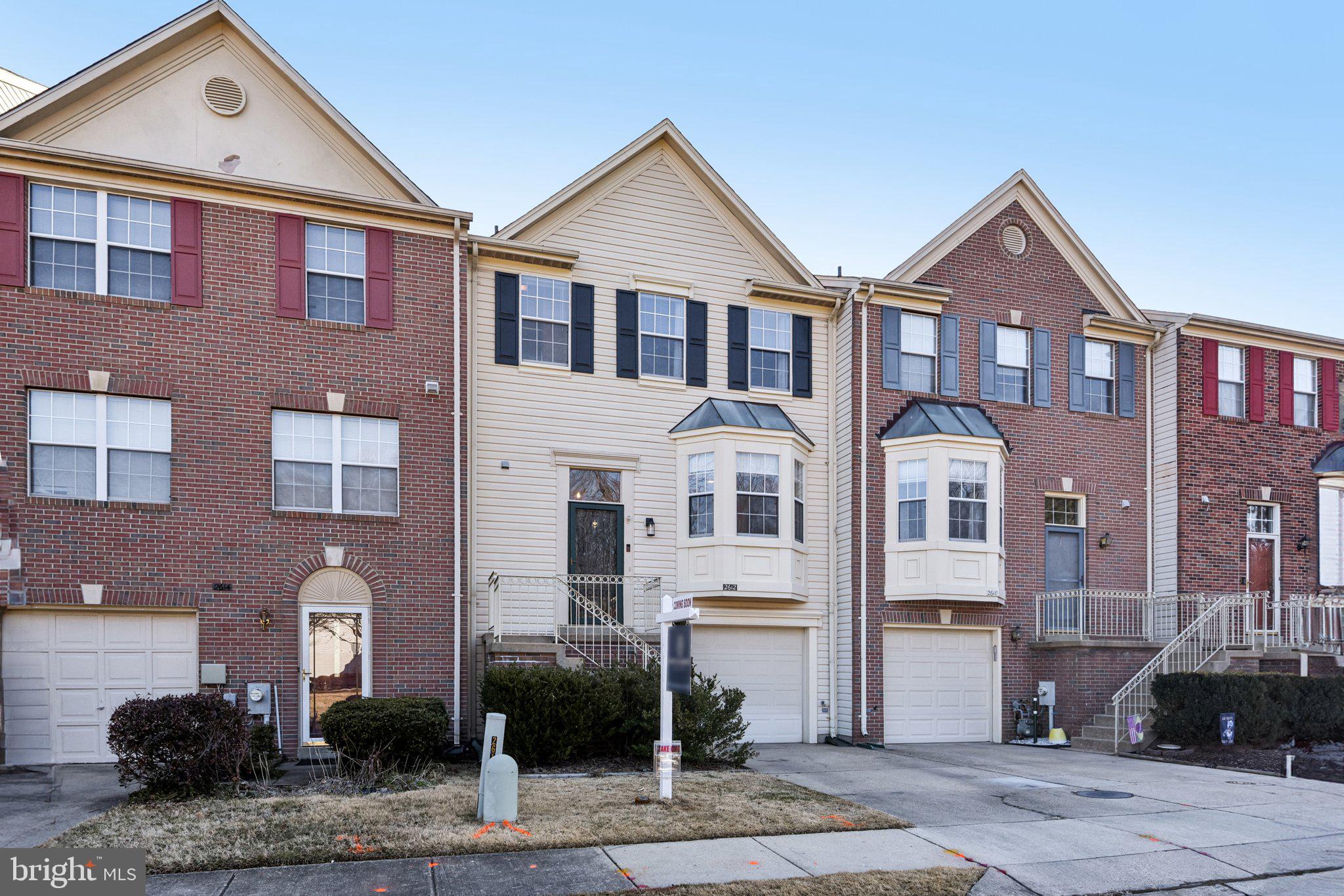 2612 Tallwind Court Crofton, MD 21054 - Photo 2 of 38 a front view of a house with a yard