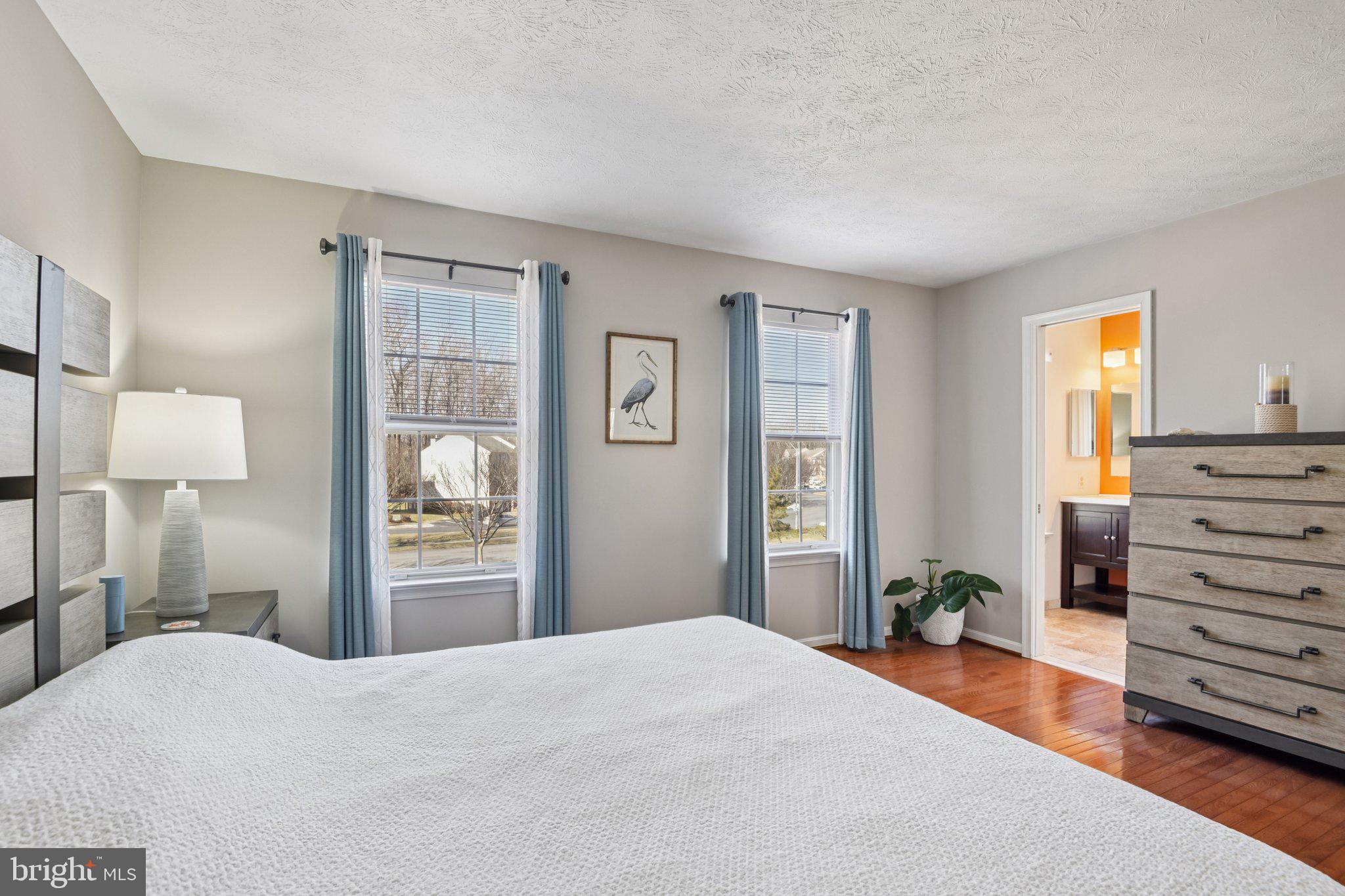 2612 Tallwind Court Crofton, MD 21054 - Photo 25 of 38 a bedroom with a bed and a dresser