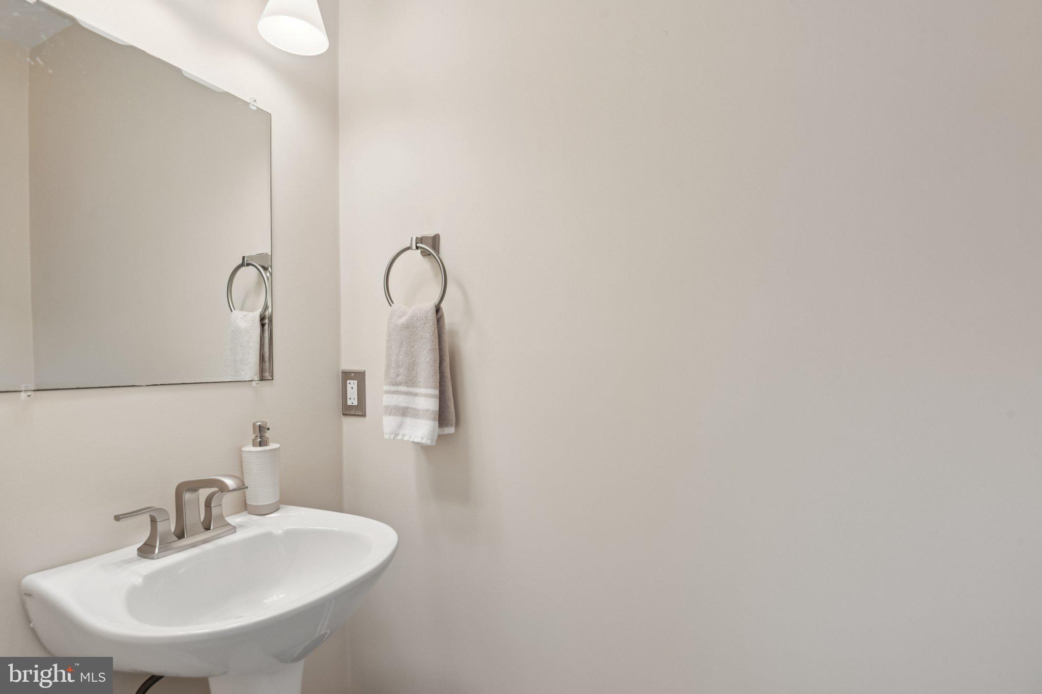 2612 Tallwind Court Crofton, MD 21054 - Photo 27 of 38 a bathroom with a sink and mirror