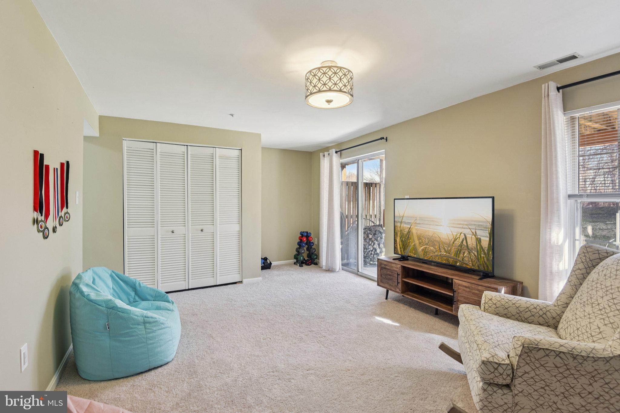2612 Tallwind Court Crofton, MD 21054 - Photo 31 of 38 a living room with furniture and a flat screen tv