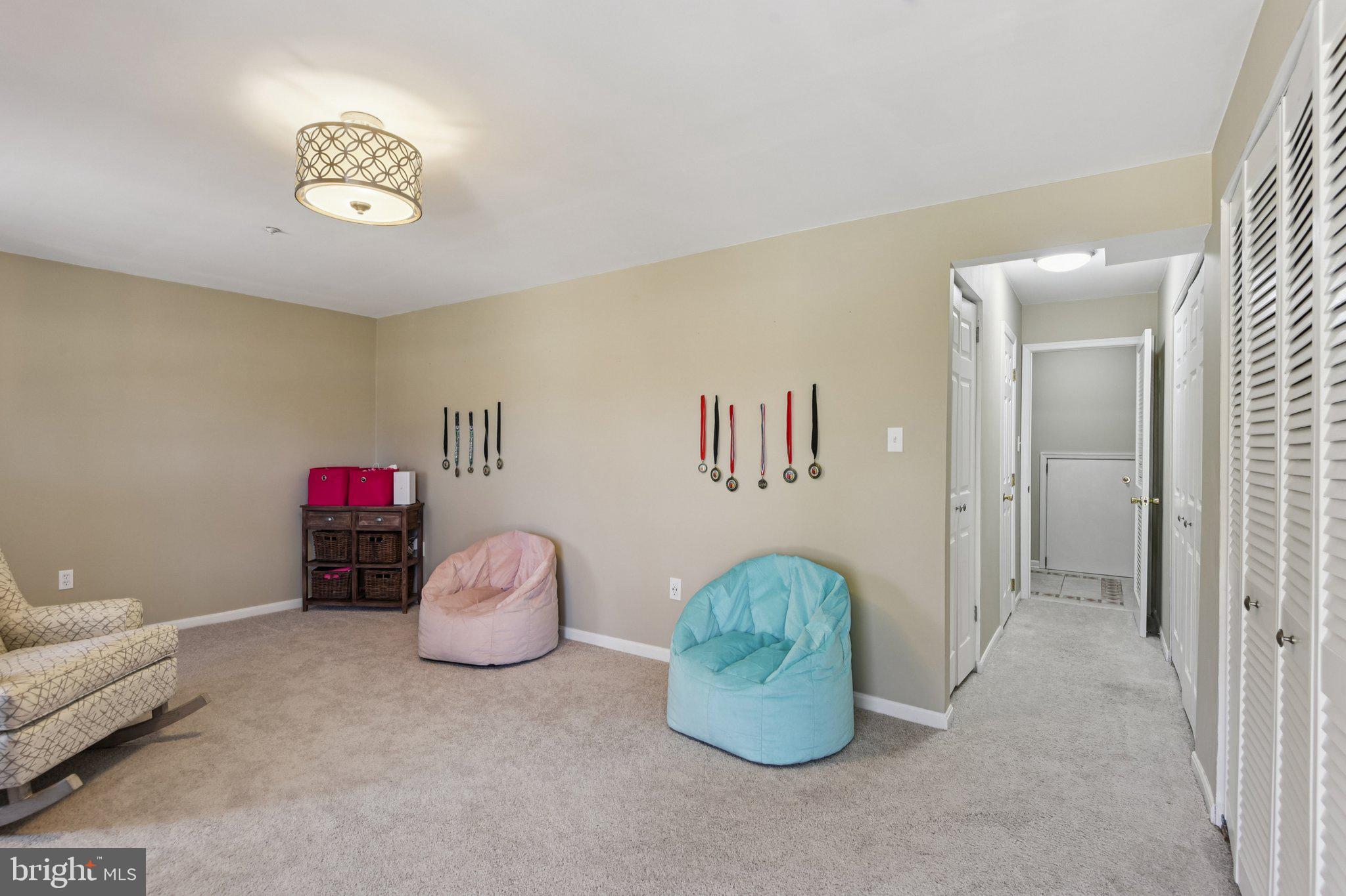 2612 Tallwind Court Crofton, MD 21054 - Photo 32 of 38 a bedroom with a bed and a chandelier