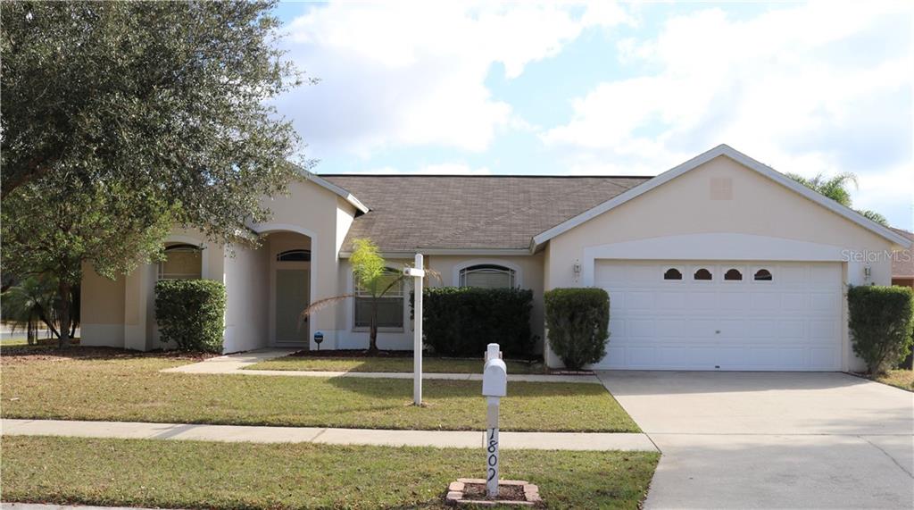 1809 Palm Ridge Place Valrico, FL 33594 - Photo 1 of 1 a view of a house with backyard and swimming pool