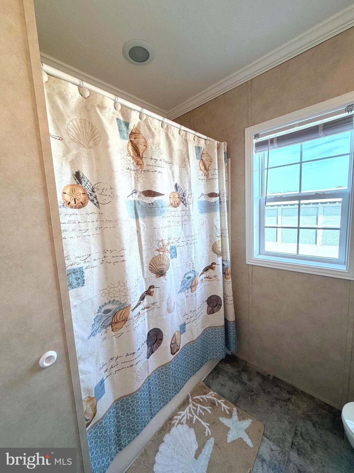 38025 Rabbit Road, Unit 101 Ocean View, DE 19970 - Photo 78 of 112 a bathroom with a glass shower door
