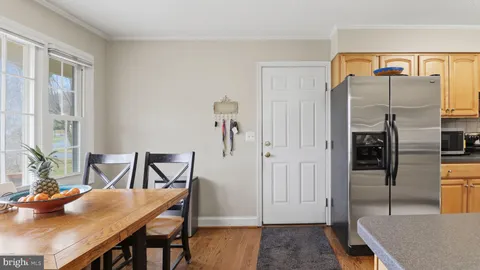 a view of bathroom with a toilet sink and mirror