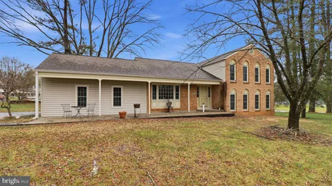 front view of a house with a large trees