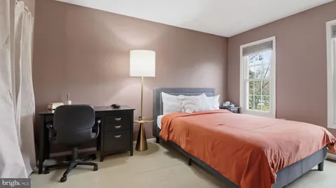 a view of a livingroom with furniture and staircase