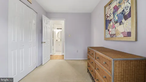 a living room with furniture and a lamp