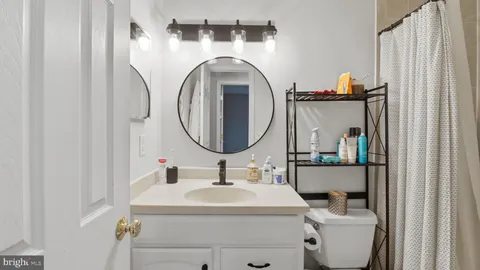a kitchen with sink and cabinets