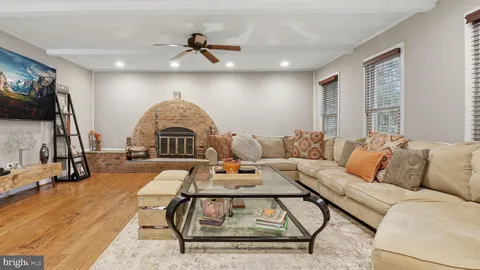 a bedroom with a bed and a flat tv screen on dresser