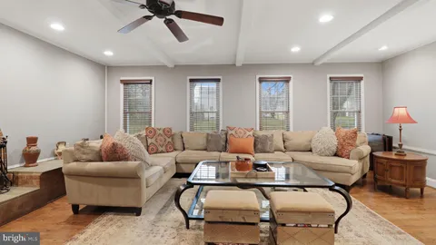 a bathroom with a sink vanity mirror and toilet