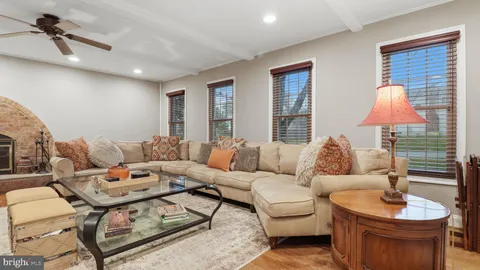 a bathroom with a sink mirror and toilet