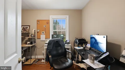 a spacious bathroom with a bathtub and shower
