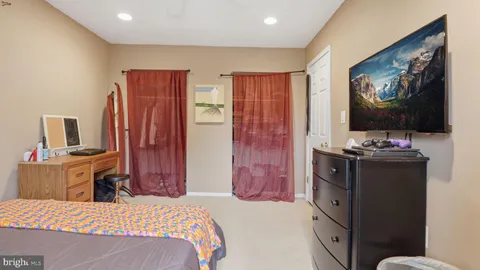 a view of storage and utility room with two washing machine