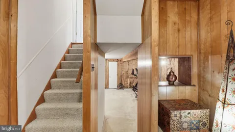 a room with furniture pool table and flat screen tv