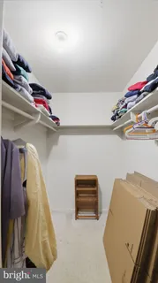 a view of a table and chairs in back yard of the house