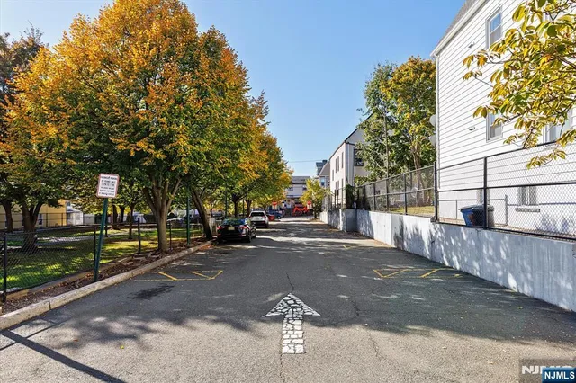 a view of a street with a building in the background
