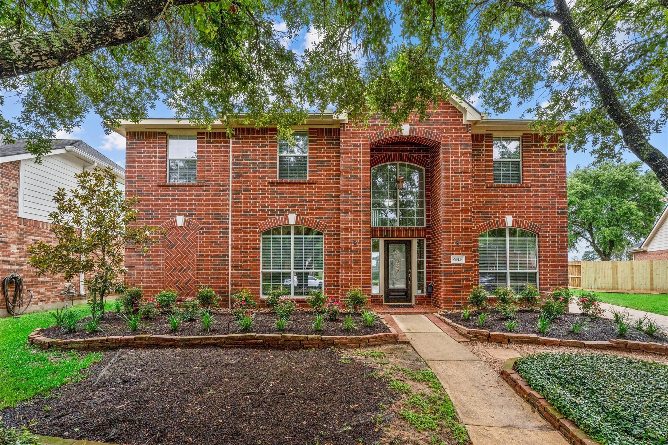 6323 Stone Trail Lane Spring, TX 77379 - Photo 2 of 43 front view of a house with a yard