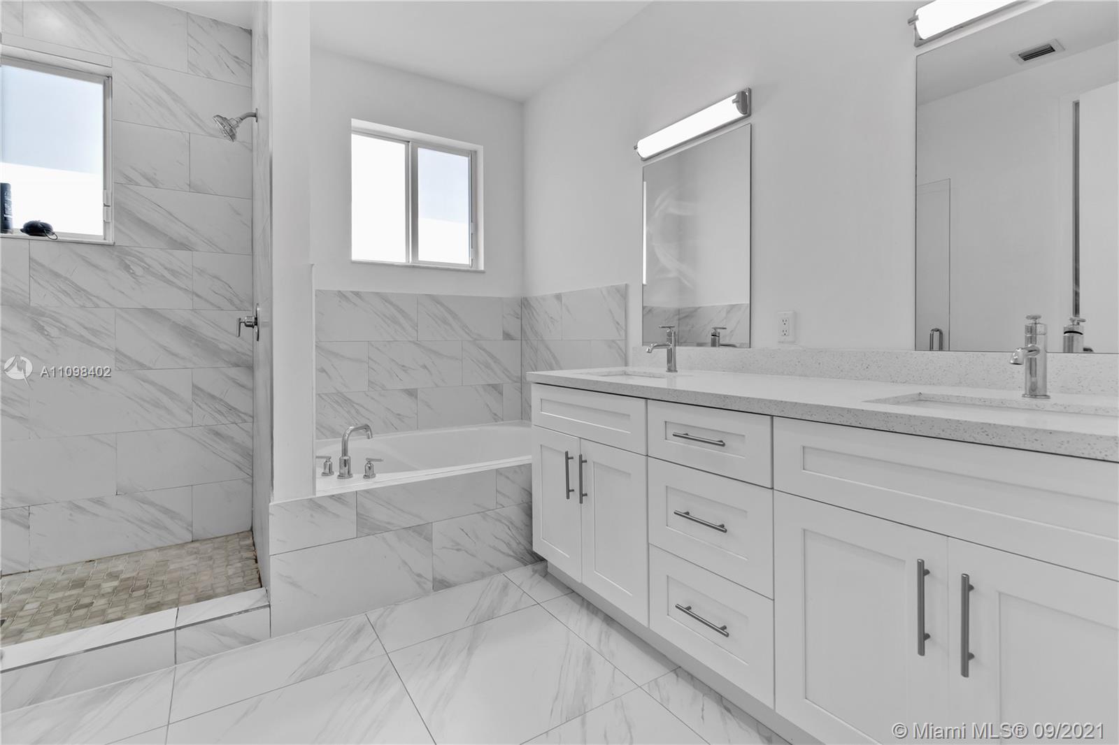 18334 Southwest 139th Path Miami, FL 33177 - Photo 11 of 62 a bath room with a sink and a bathtub