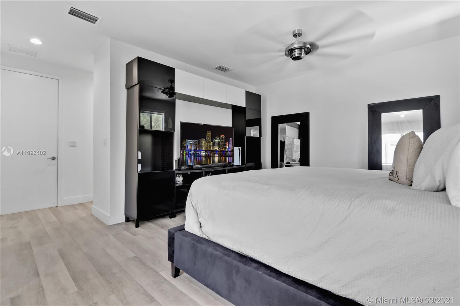 18334 Southwest 139th Path Miami, FL 33177 - Photo 14 of 62 a bed room with a bed and a ceiling fan