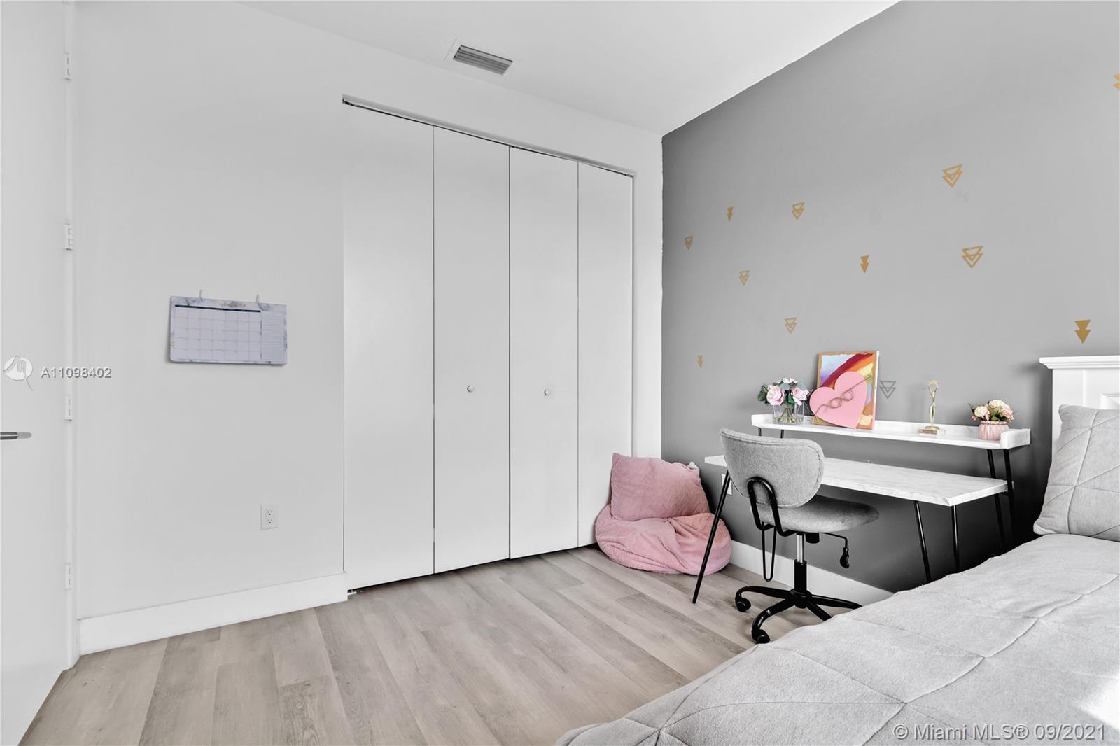 18334 Southwest 139th Path Miami, FL 33177 - Photo 17 of 62 a living room with furniture and a wooden floor