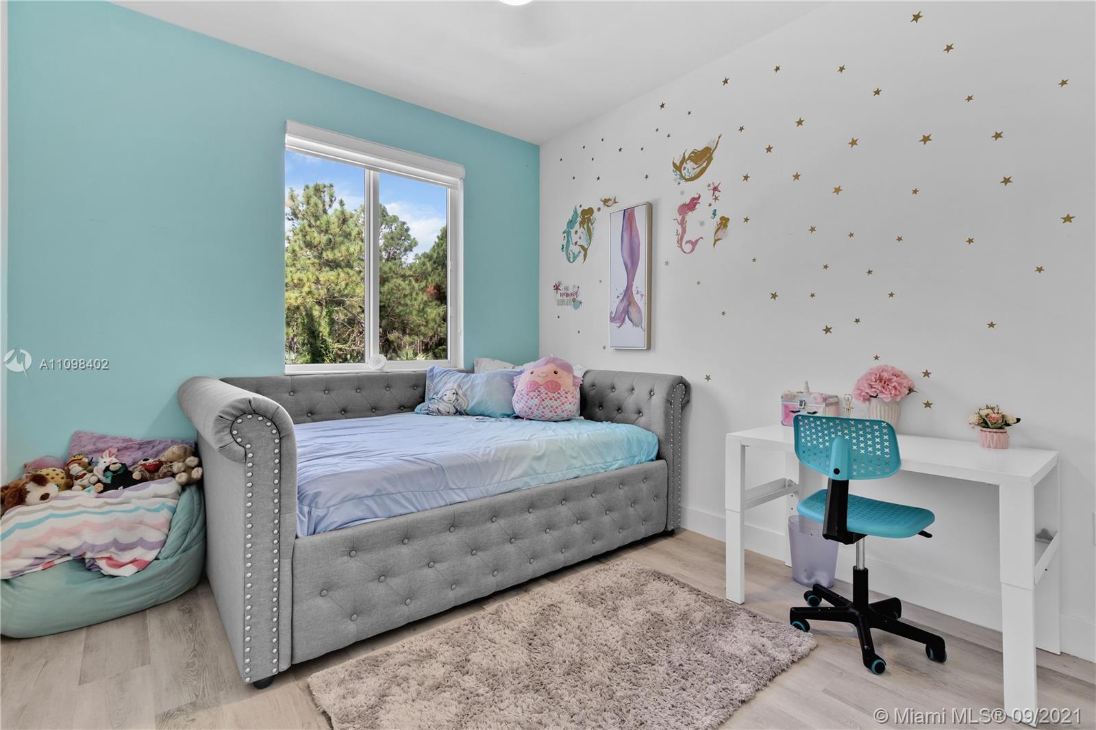 18334 Southwest 139th Path Miami, FL 33177 - Photo 20 of 62 a bedroom with a bed and a window