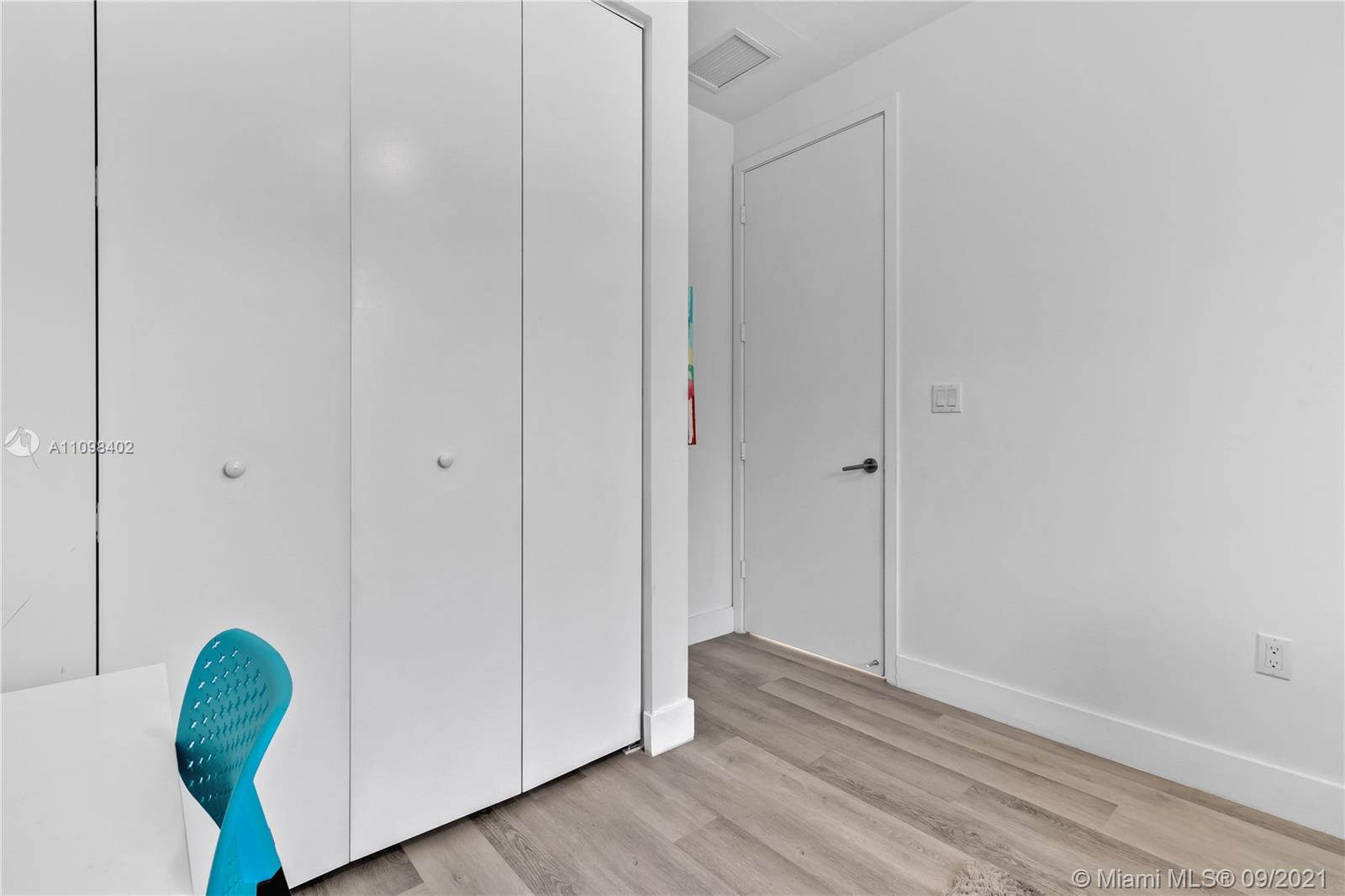 18334 Southwest 139th Path Miami, FL 33177 - Photo 21 of 62 a view of empty room with wooden floor