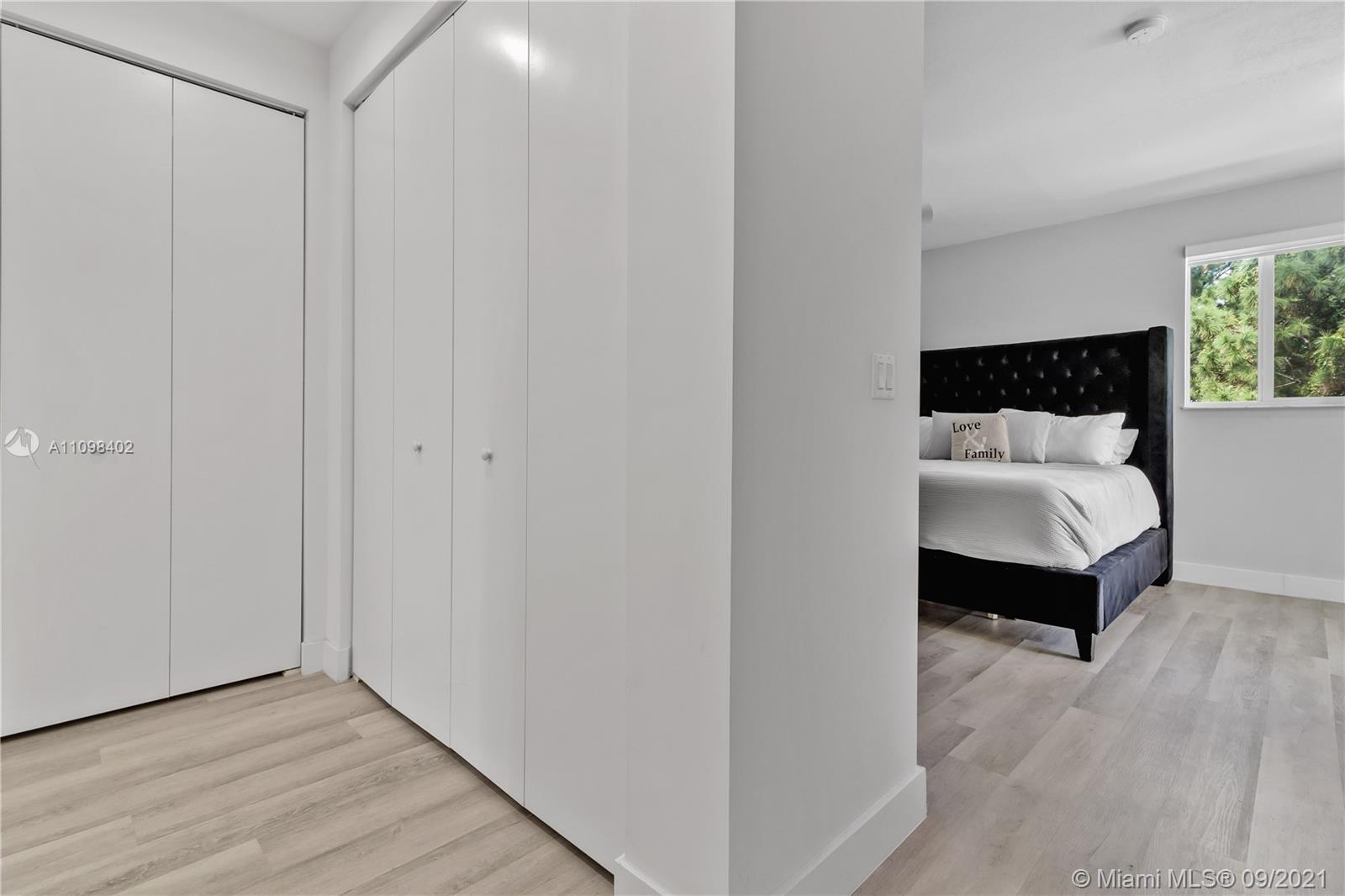 18334 Southwest 139th Path Miami, FL 33177 - Photo 24 of 62 a bedroom with a bed and a chair