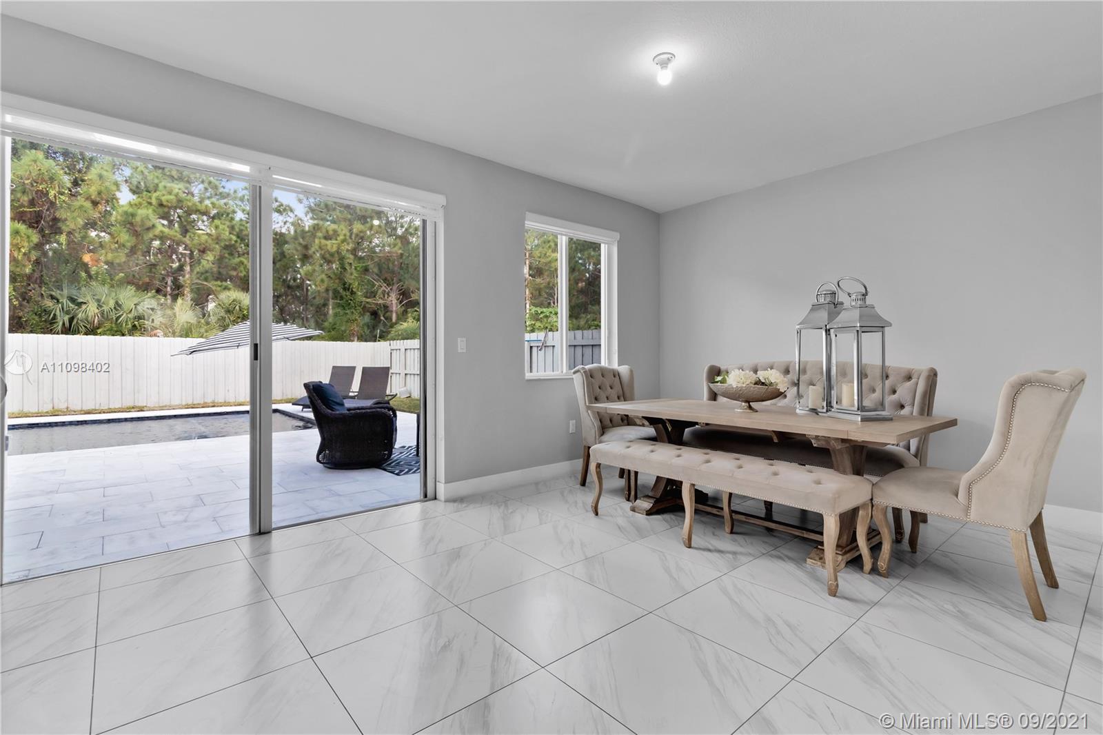 18334 Southwest 139th Path Miami, FL 33177 - Photo 38 of 62 a view of a workspace with furniture and a window