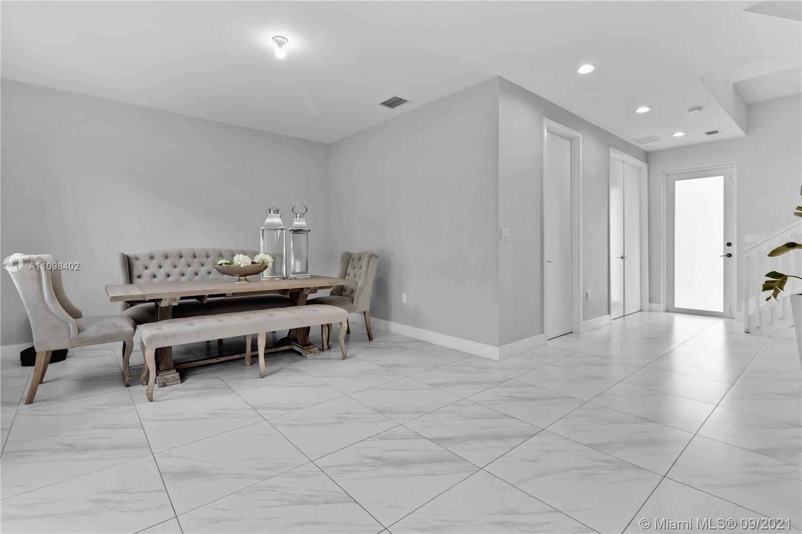 18334 Southwest 139th Path Miami, FL 33177 - Photo 39 of 62 a dining room with furniture and a table