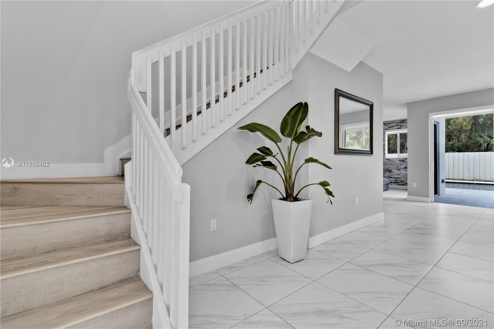 18334 Southwest 139th Path Miami, FL 33177 - Photo 40 of 62 a view of stairs with wooden floor