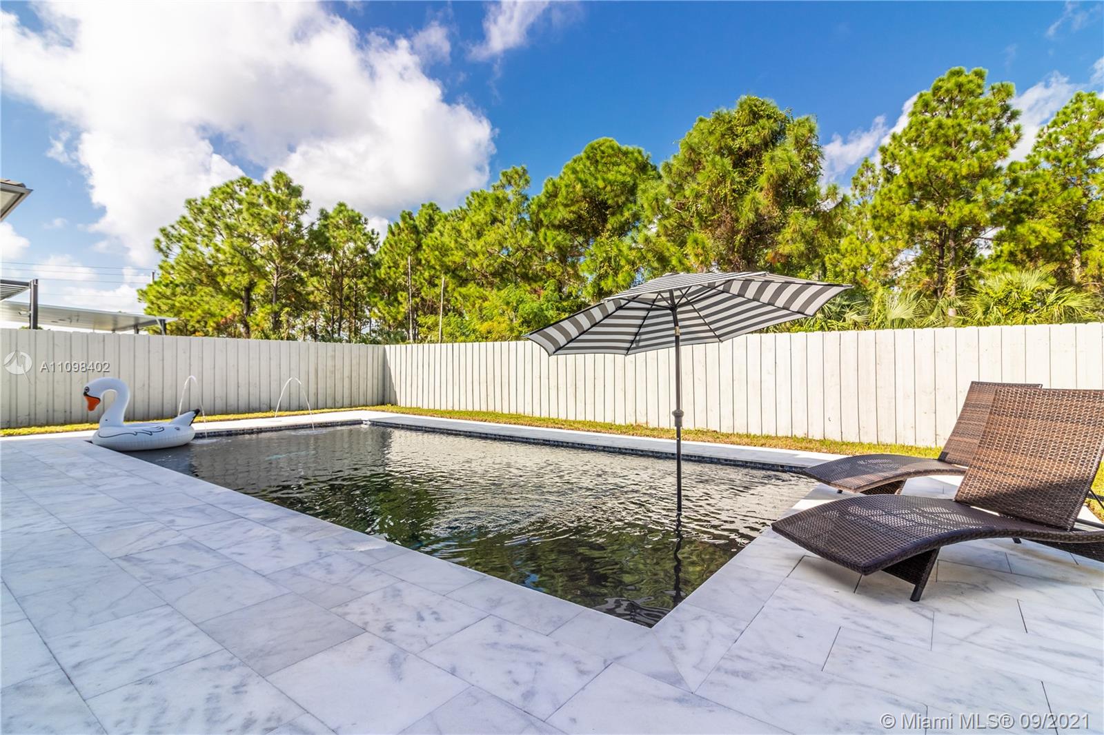 18334 Southwest 139th Path Miami, FL 33177 - Photo 5 of 62 a backyard of a house with lots of green space