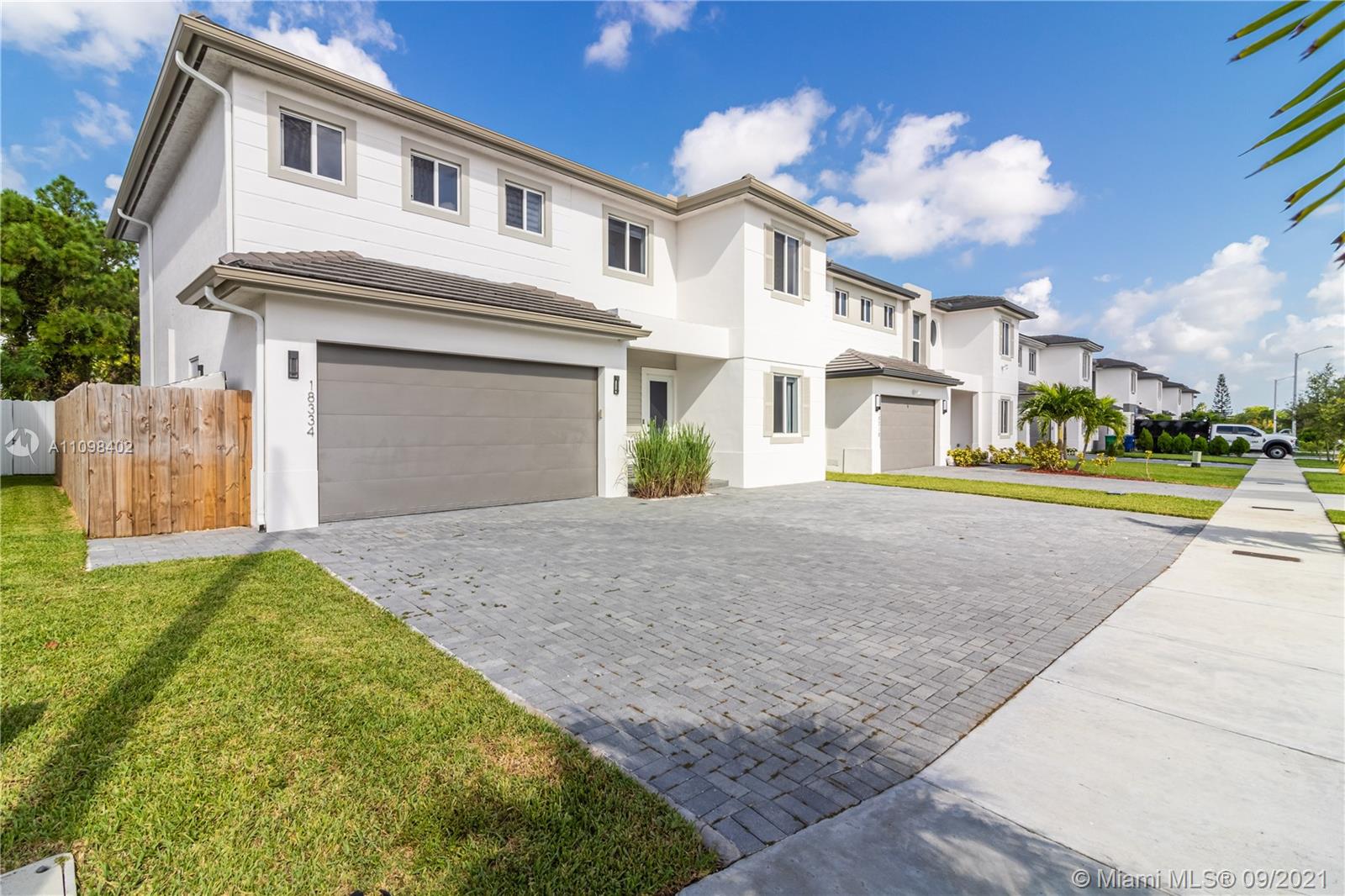 18334 Southwest 139th Path Miami, FL 33177 - Photo 43 of 62 a front view of a house with a yard