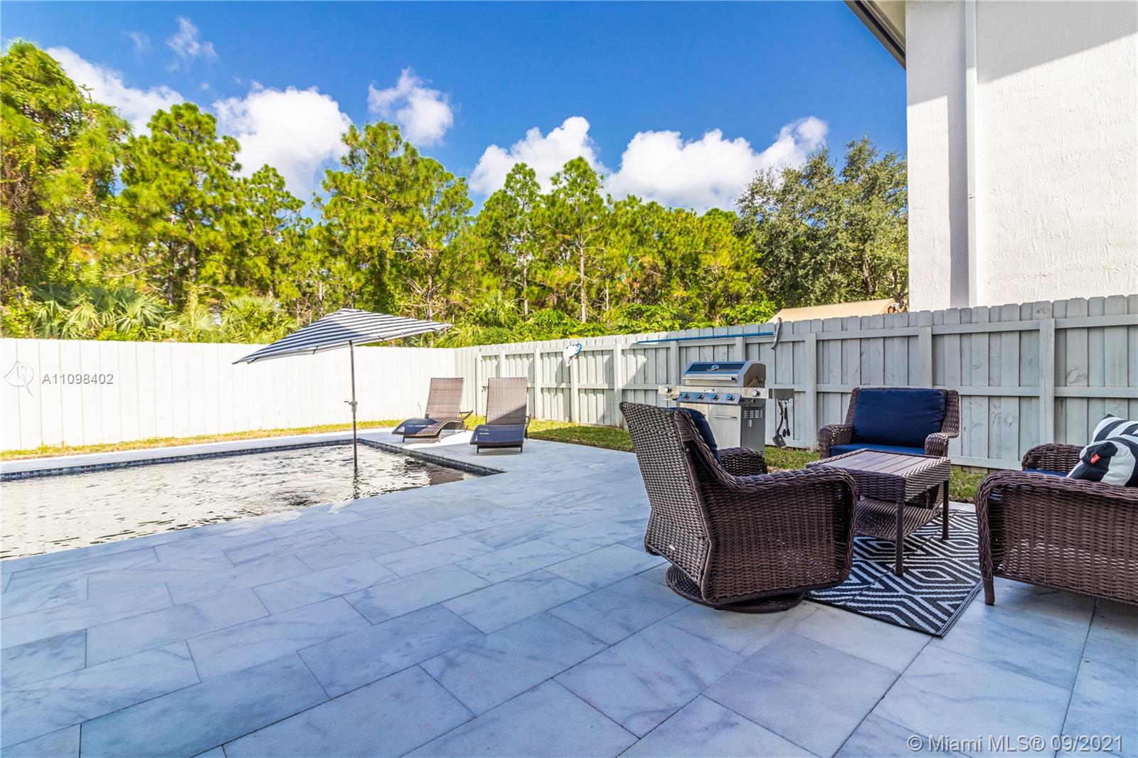 18334 Southwest 139th Path Miami, FL 33177 - Photo 44 of 62 a view of a terrace with furniture