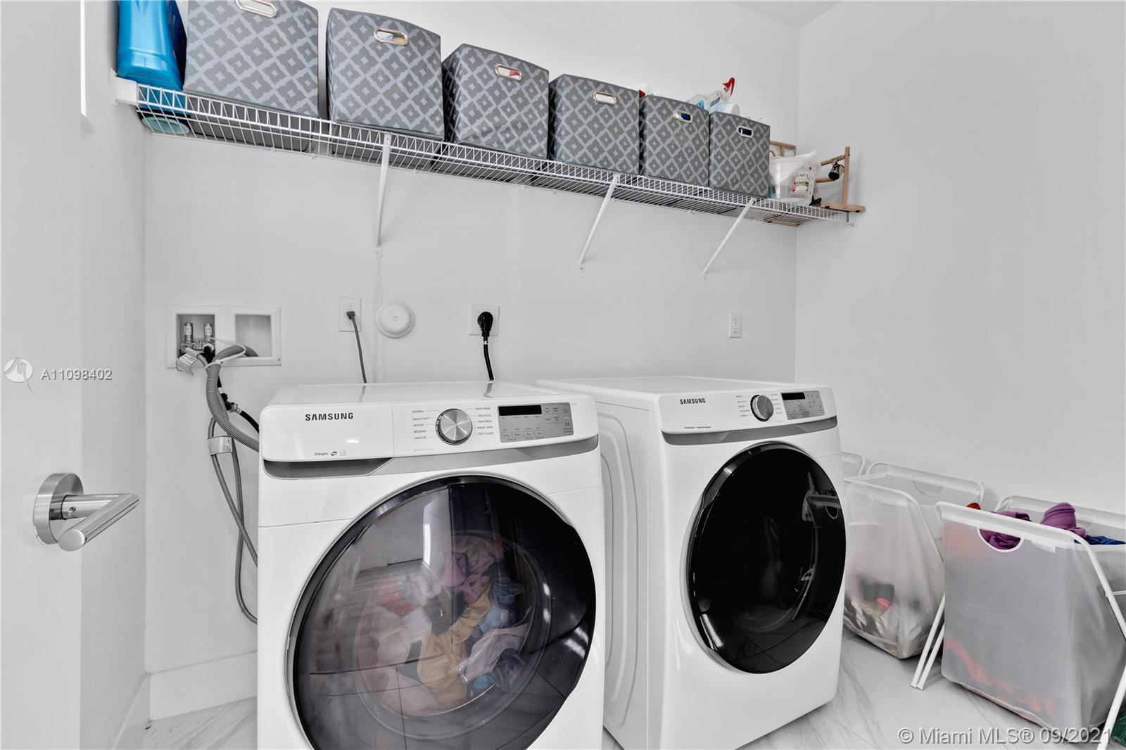 18334 Southwest 139th Path Miami, FL 33177 - Photo 47 of 62 a utility room with dryer and washer