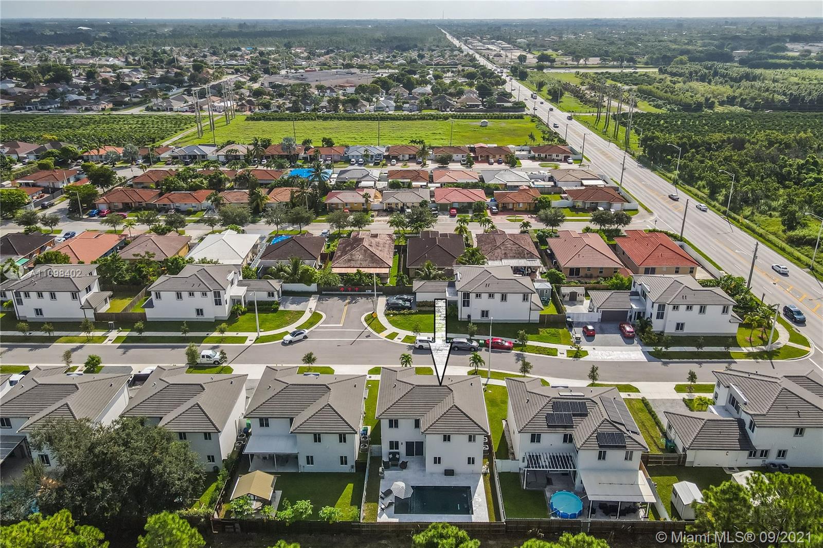 18334 Southwest 139th Path Miami, FL 33177 - Photo 50 of 62 an aerial view of residential building and lake
