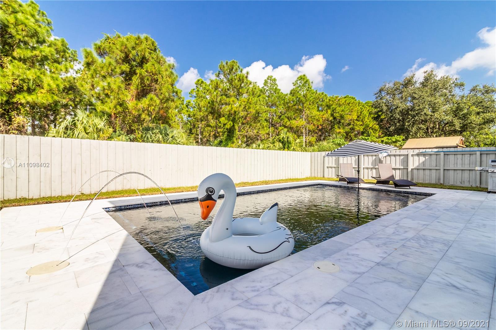 18334 Southwest 139th Path Miami, FL 33177 - Photo 6 of 62 a view of swimming pool with a patio and a seating space
