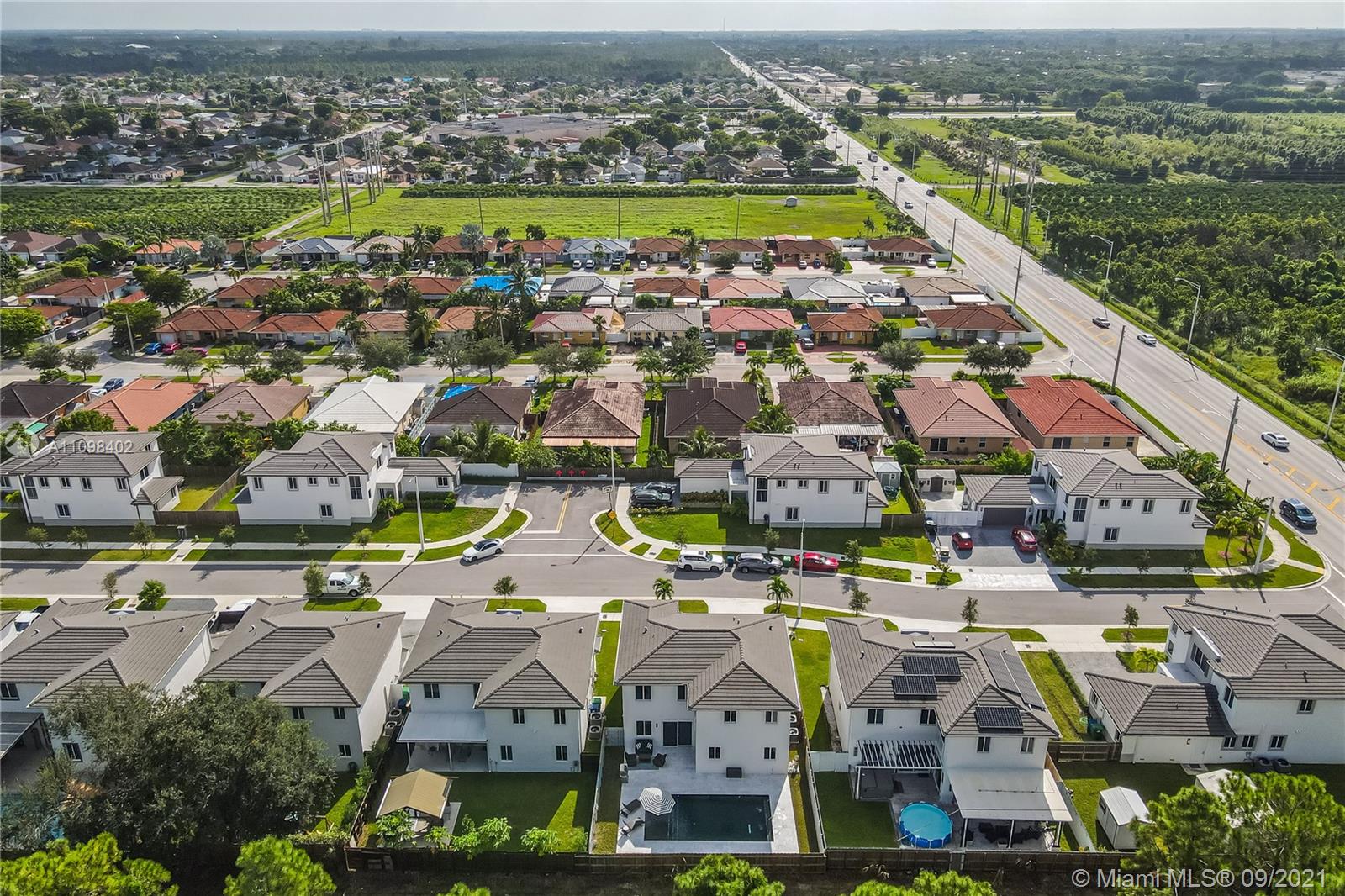 18334 Southwest 139th Path Miami, FL 33177 - Photo 51 of 62 an aerial view of residential building and lake