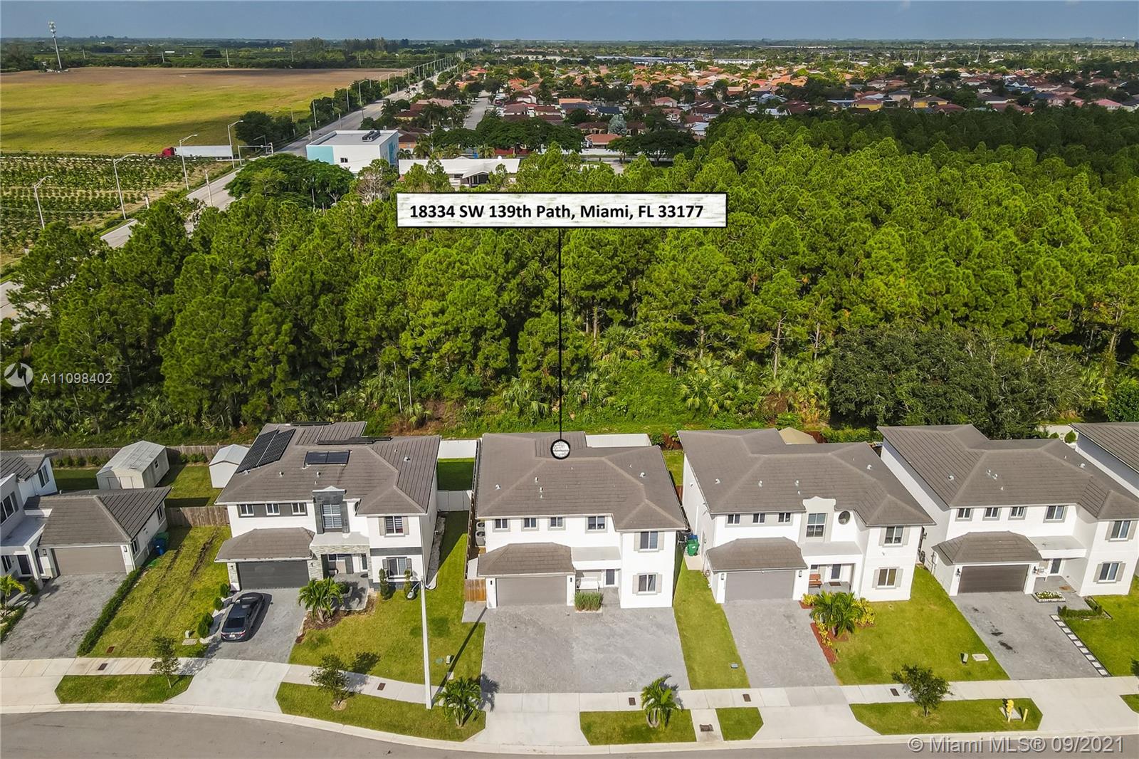 18334 Southwest 139th Path Miami, FL 33177 - Photo 56 of 62 an aerial view of residential houses with outdoor space and swimming pool