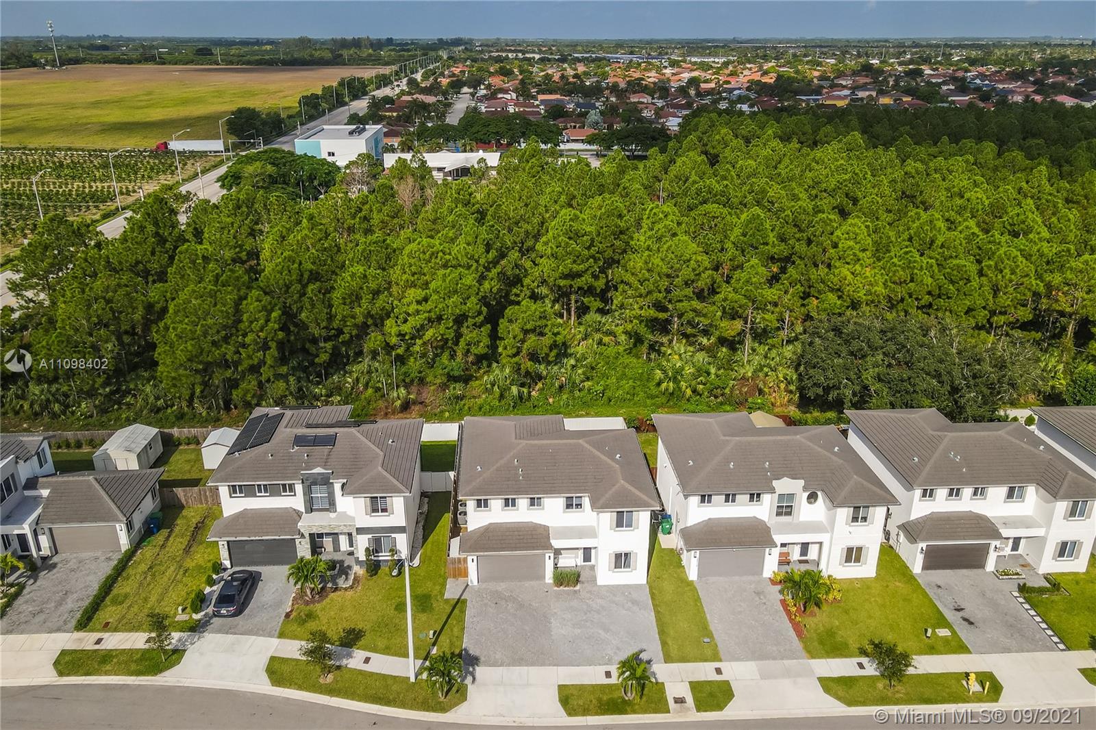 18334 Southwest 139th Path Miami, FL 33177 - Photo 57 of 62 an aerial view of residential houses with outdoor space and swimming pool