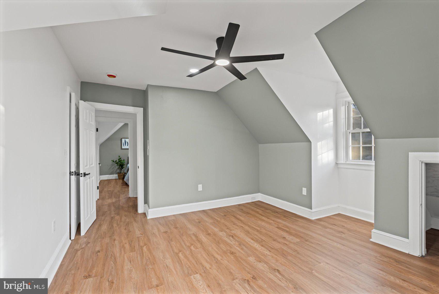 7 York Court Baltimore, MD 21218 - Photo 29 of 42 wooden floor in an empty room with a window