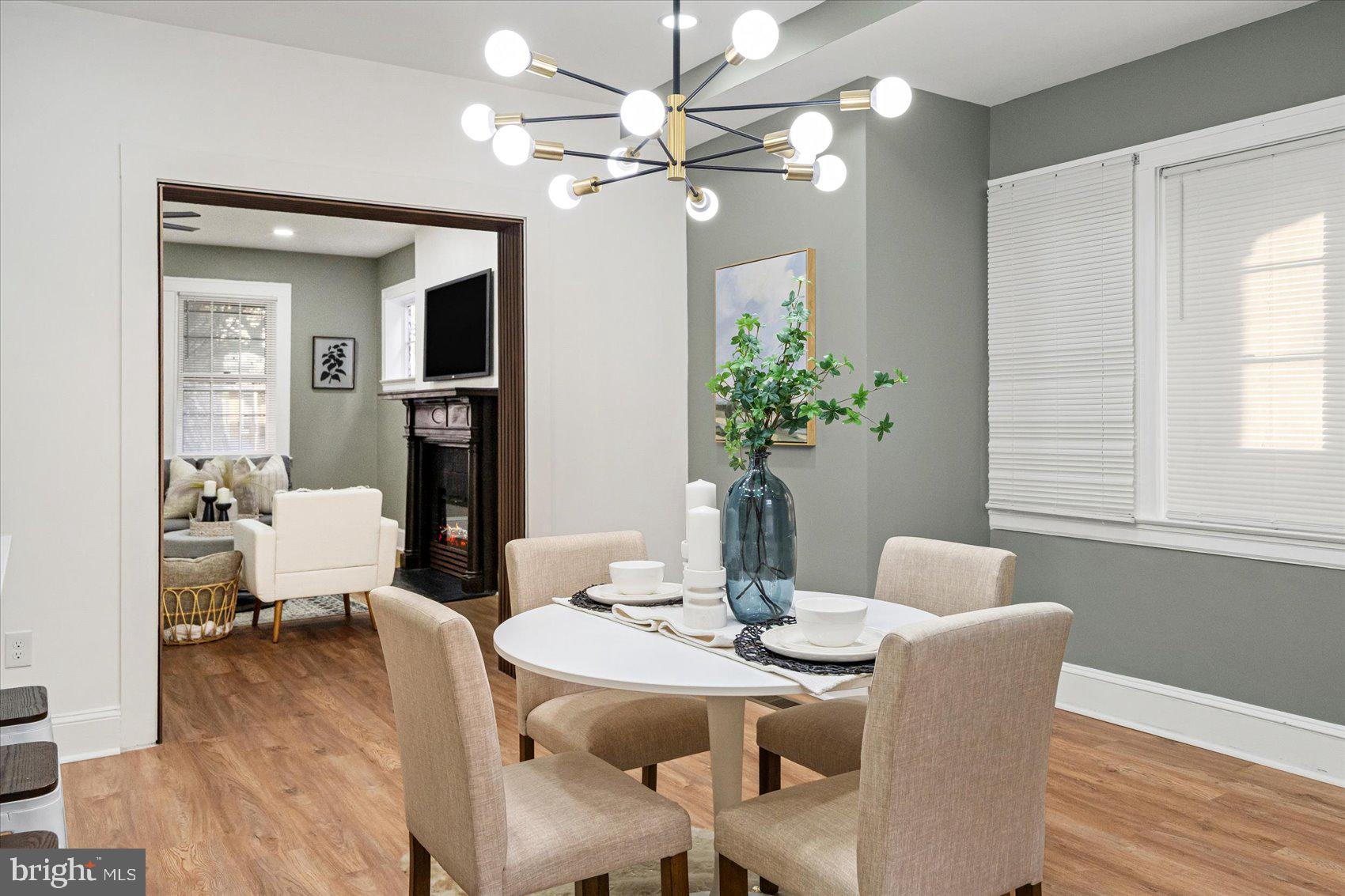 7 York Court Baltimore, MD 21218 - Photo 10 of 42 a dining room with furniture potted plants and wooden floor