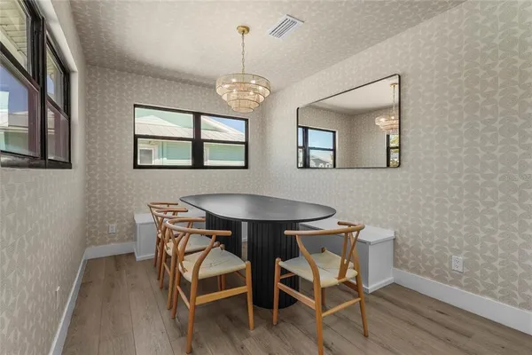 a view of a room with painting on the wall