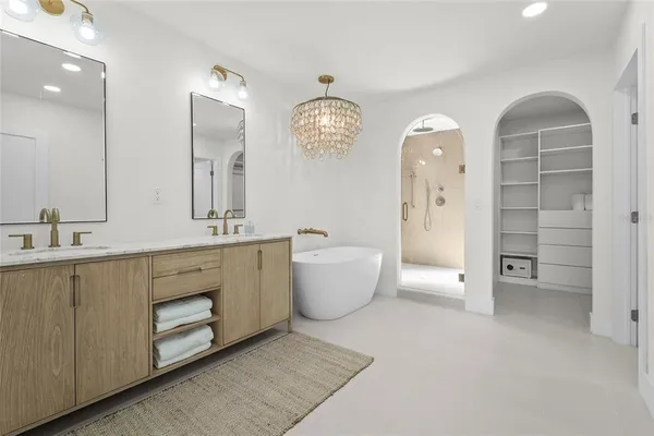 an aerial view of a house with outdoor seating