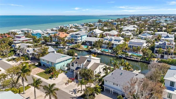 a bedroom with a bed and ceiling cabinets