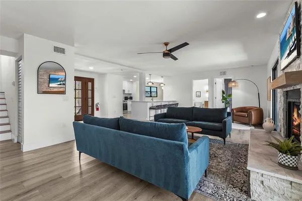 a bedroom with bed and a chandelier