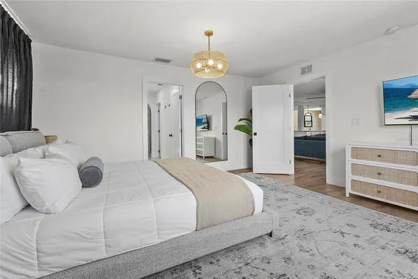 a bathroom with a granite countertop sink a toilet and a mirror