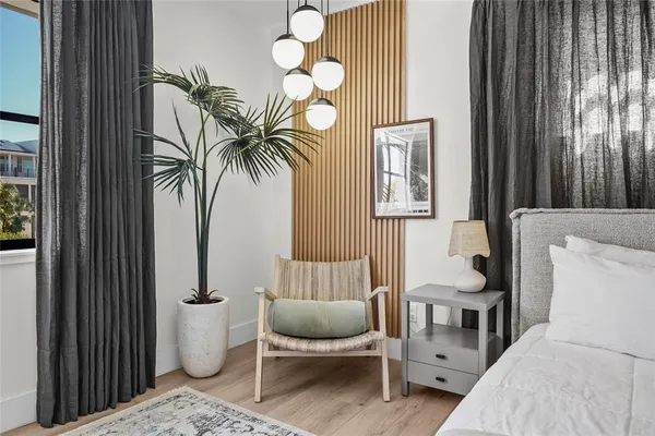 a view of a room with furniture and a window