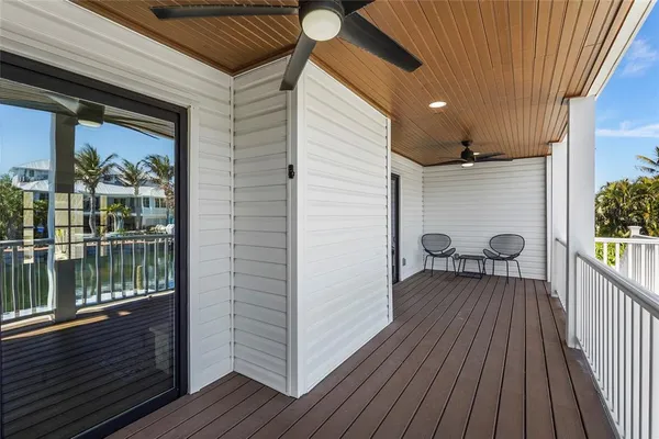 a view of a swimming pool with outdoor seating