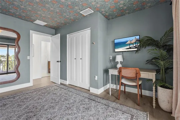 an aerial view of a house with a yard and sitting area