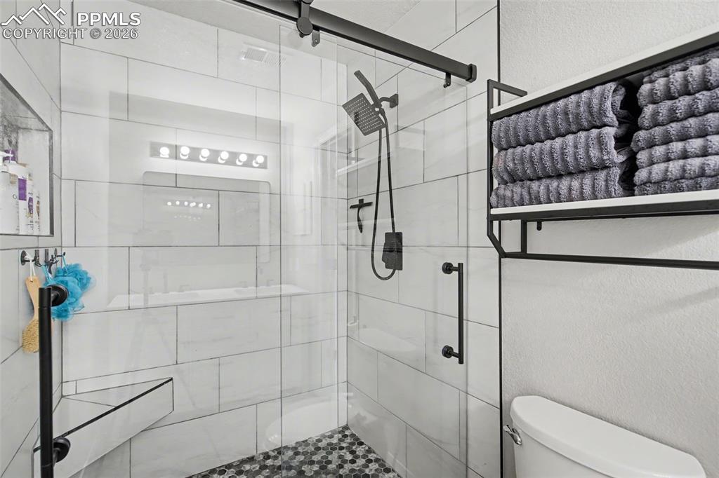 4833 Harrier Ridge Drive Colorado Springs, CO 80916 - Photo 18 of 25 a bathroom with a shower